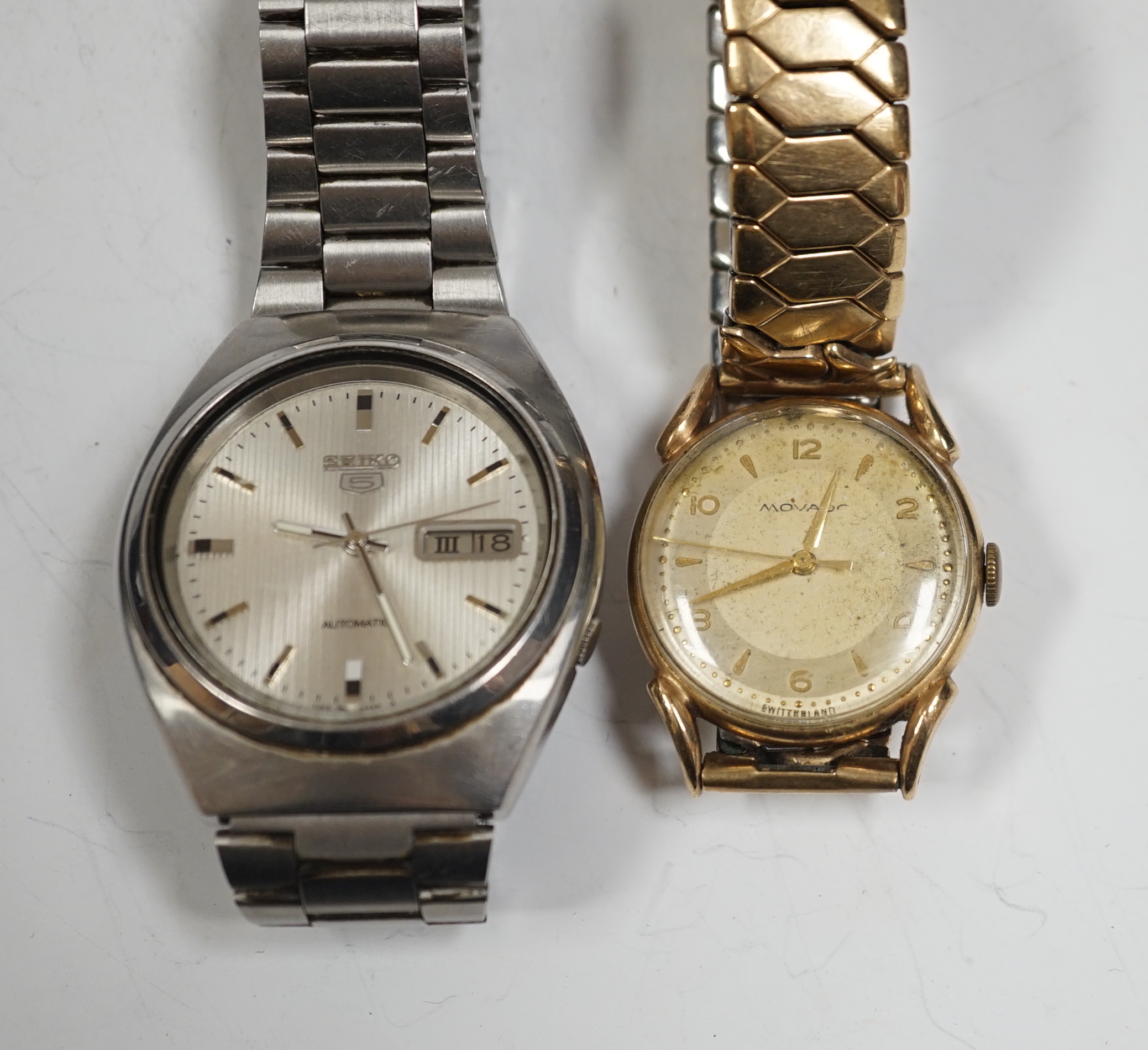 A gentleman's 9ct gold Movado manual wind wrist watch, on associated steel and gold plated flexible strap and a gentleman's stainless steel Seiko 5 automatic wrist watch.